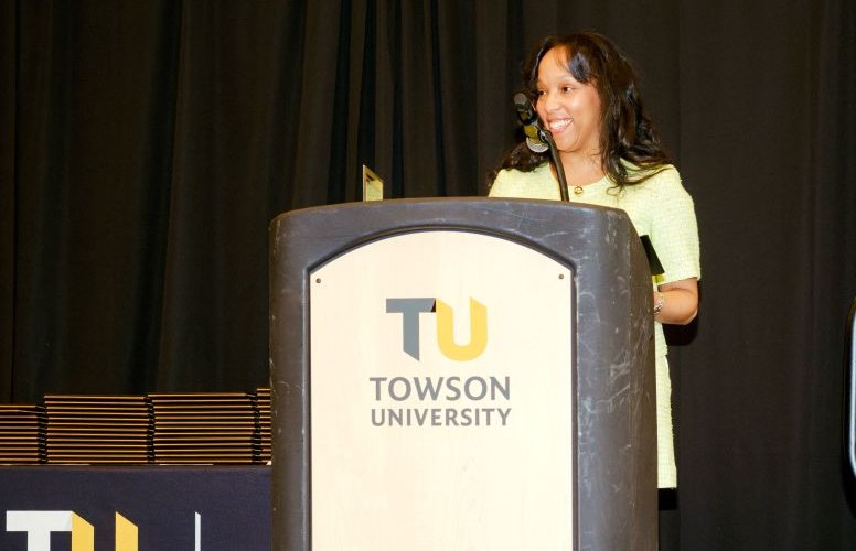 Candice Bryant delivering the Honors College Alumna of the Year address at Towson University
